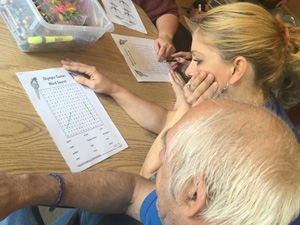 people doing crossword puzzles